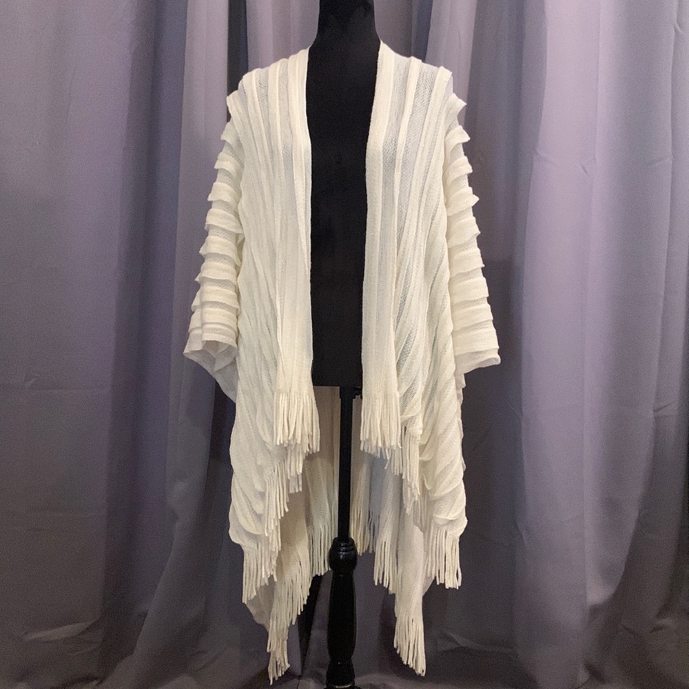 Brand New w/ Tags Ruana Cream Colored Wrap. It’s like wearing a soft blanket!